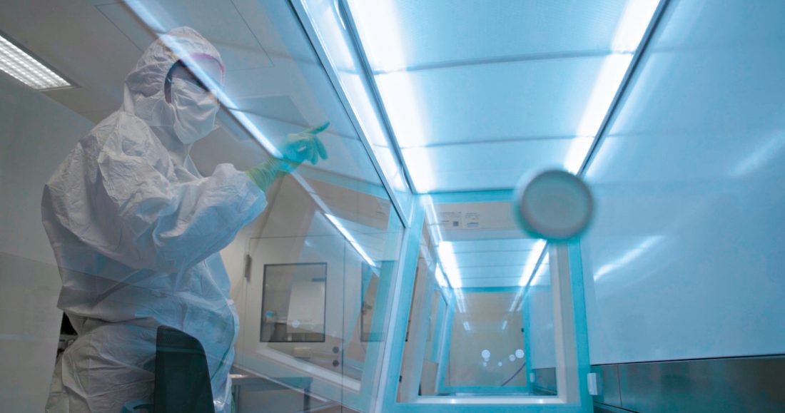 Person working in a cleanroom.